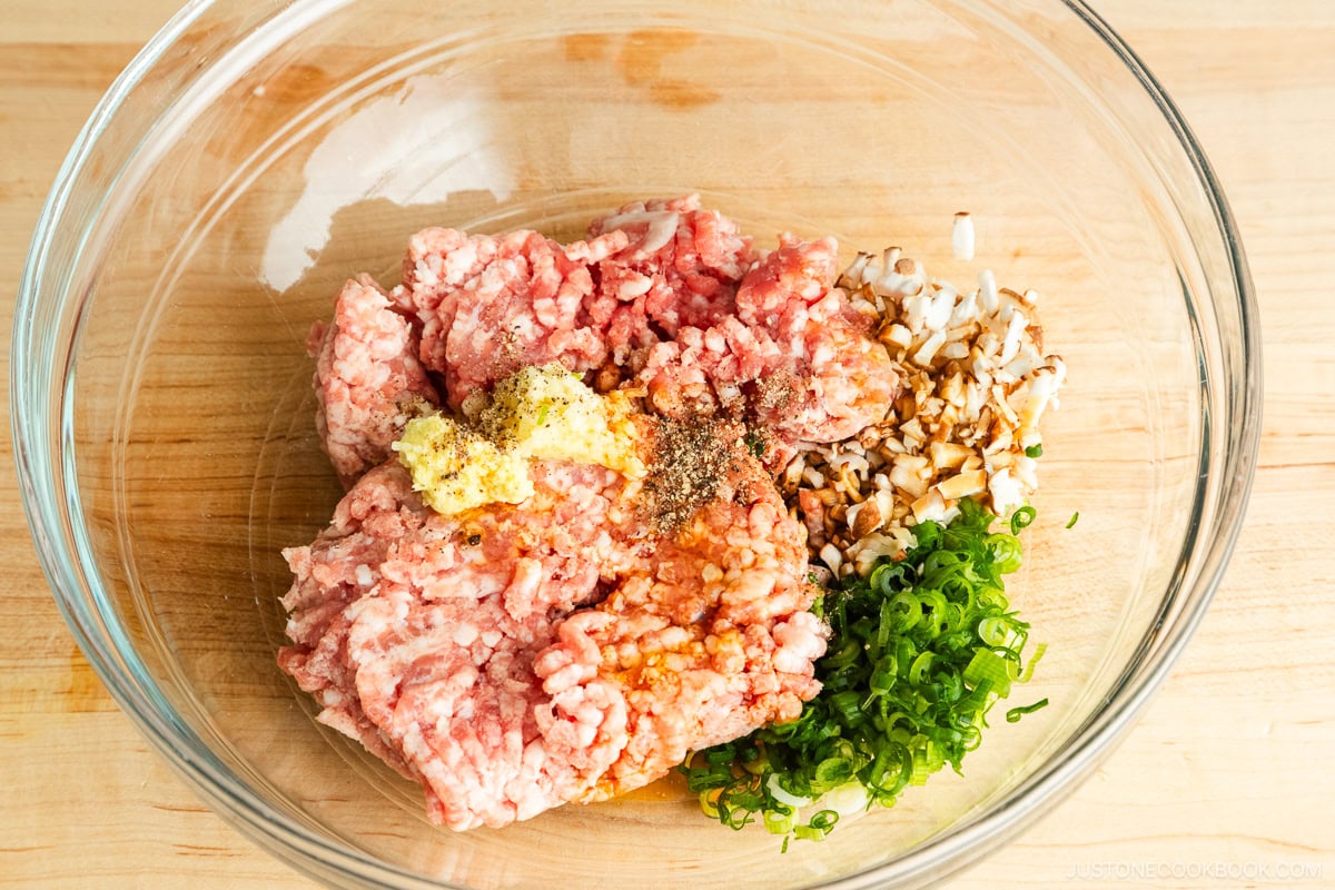 Gyoza ingredients in a glass bowl.