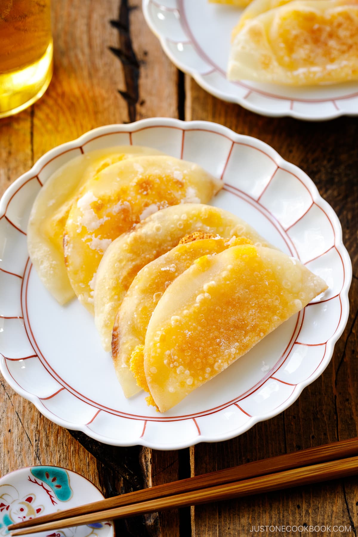 A round plate containing crispy cheese wraps.