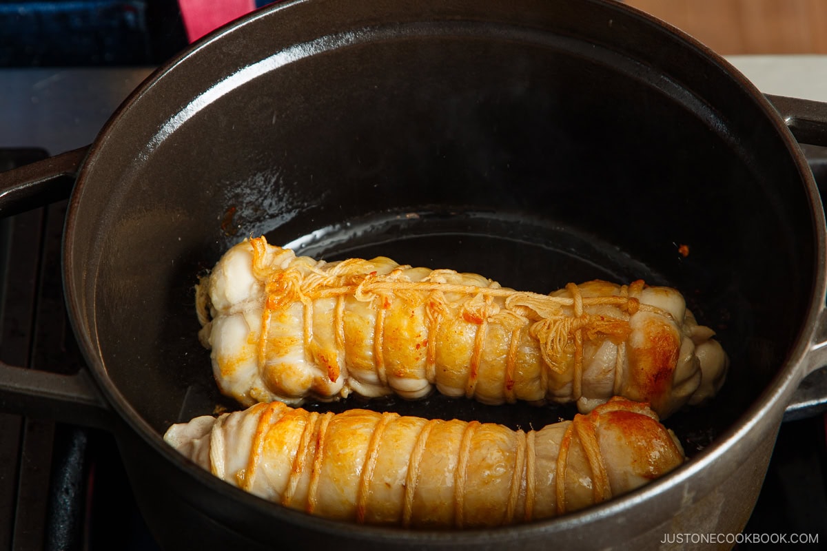 Sear the chicken in the oil, seam side down. Rotate to brown all sides.