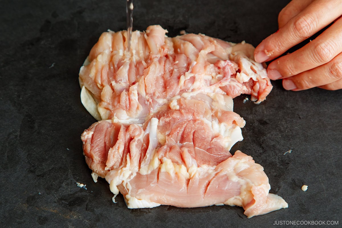 Open up the chicken and even out the thickness.