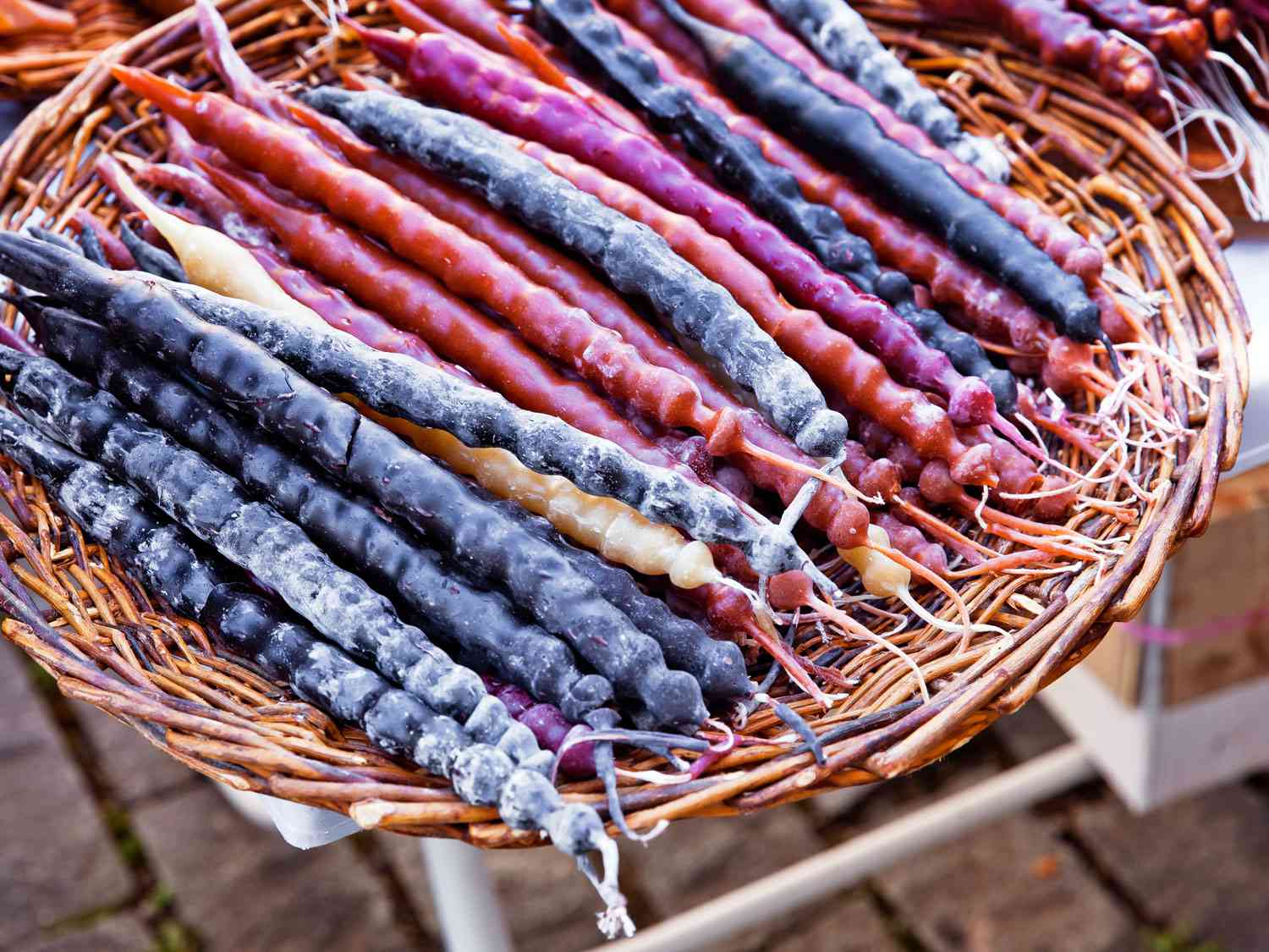 A basket of churchkhela, a Georgian confection made of grape juice and strands of walnuts.