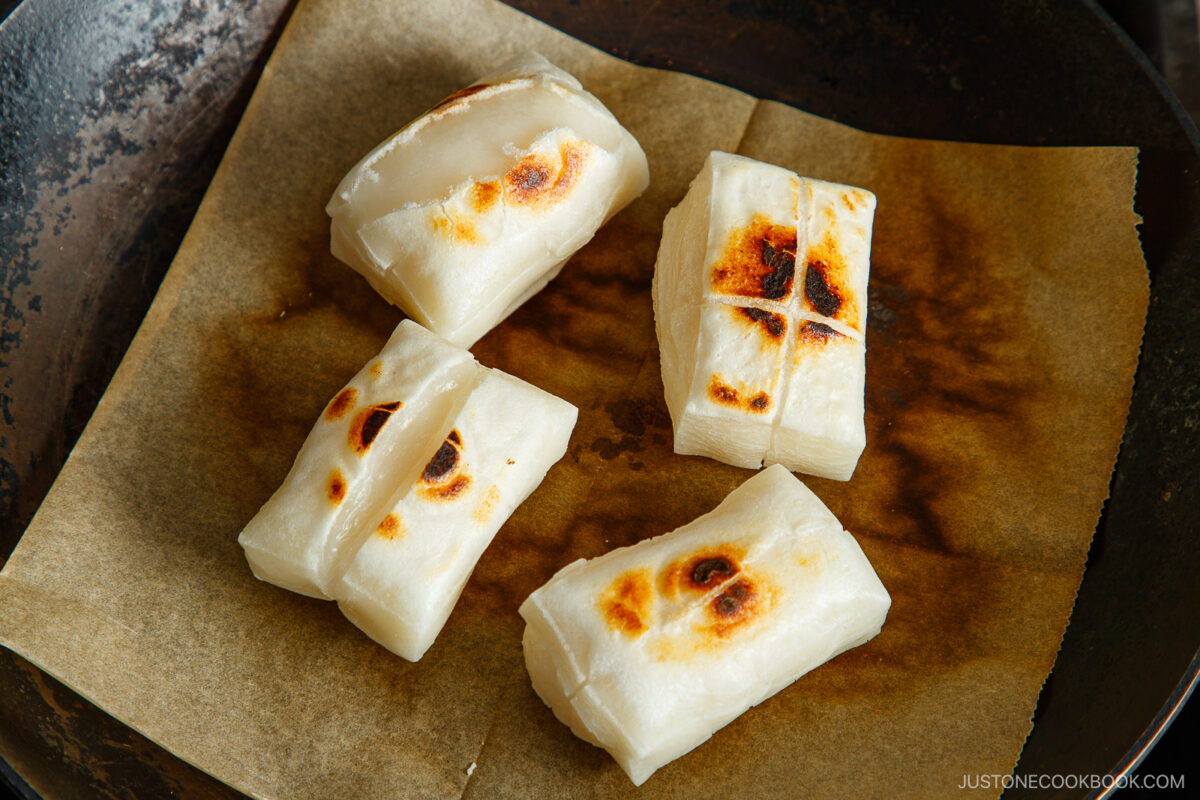 Toast mochi until puff up on both sides.