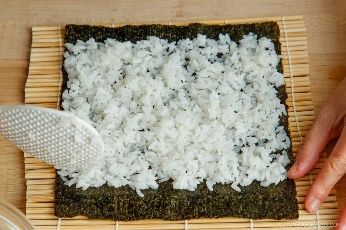 Spread the sushi rice to the nori.