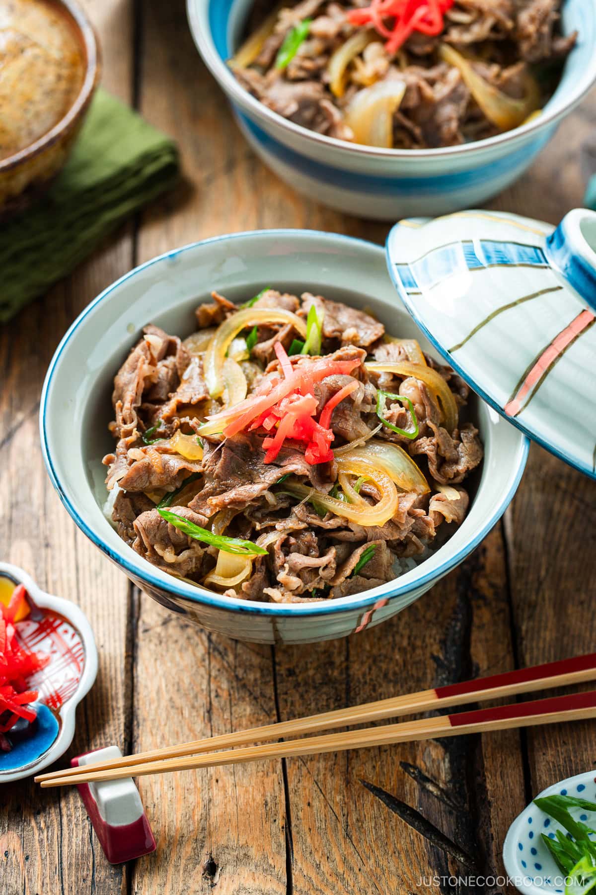 Donburi rice bowls containing gyudon, simmered beef and onions over steamed rice.