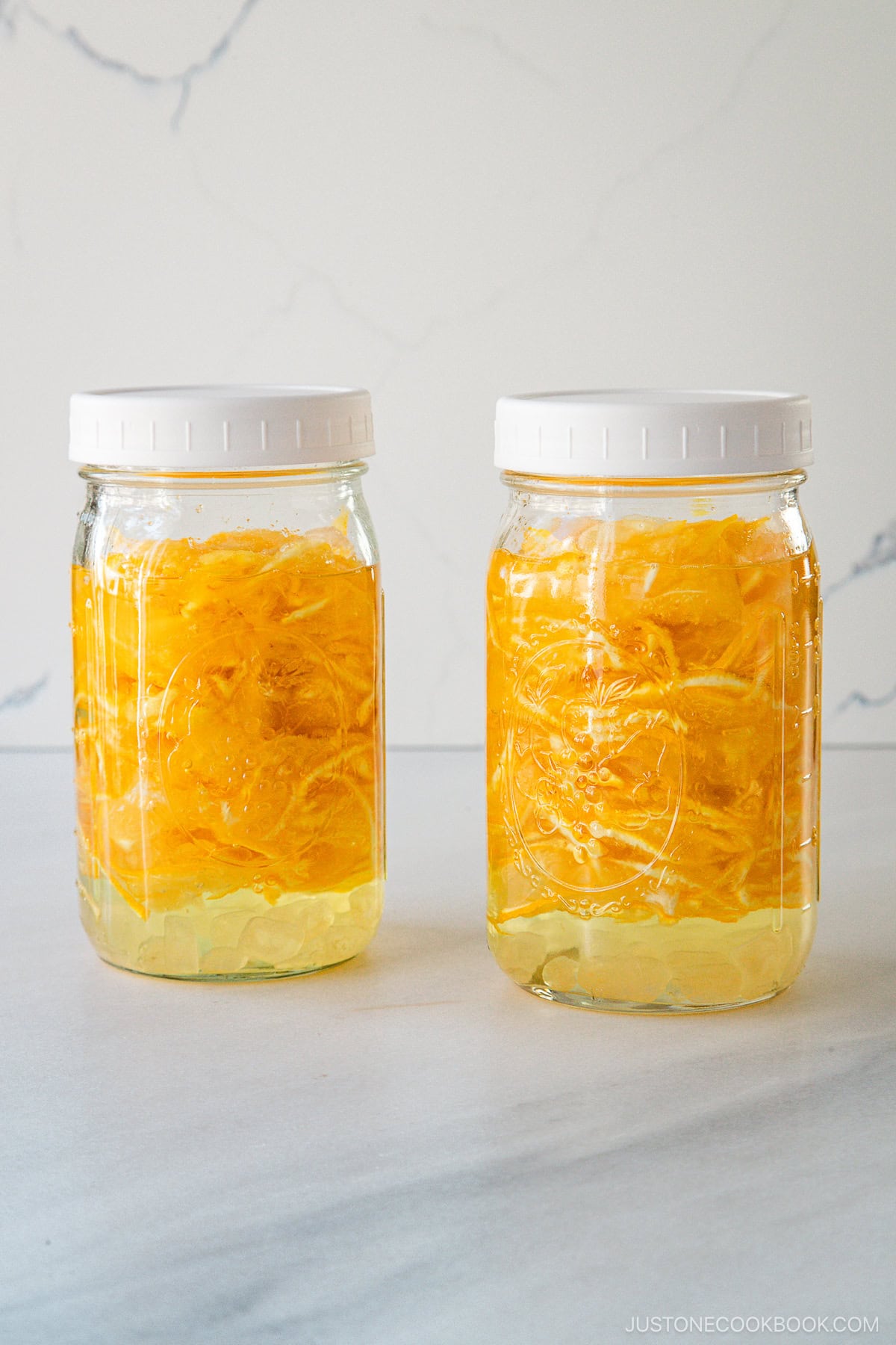 Two mason jars filled with yuzu cha (citron tea).