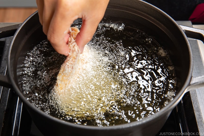 Deep fry the breaded pork loin.