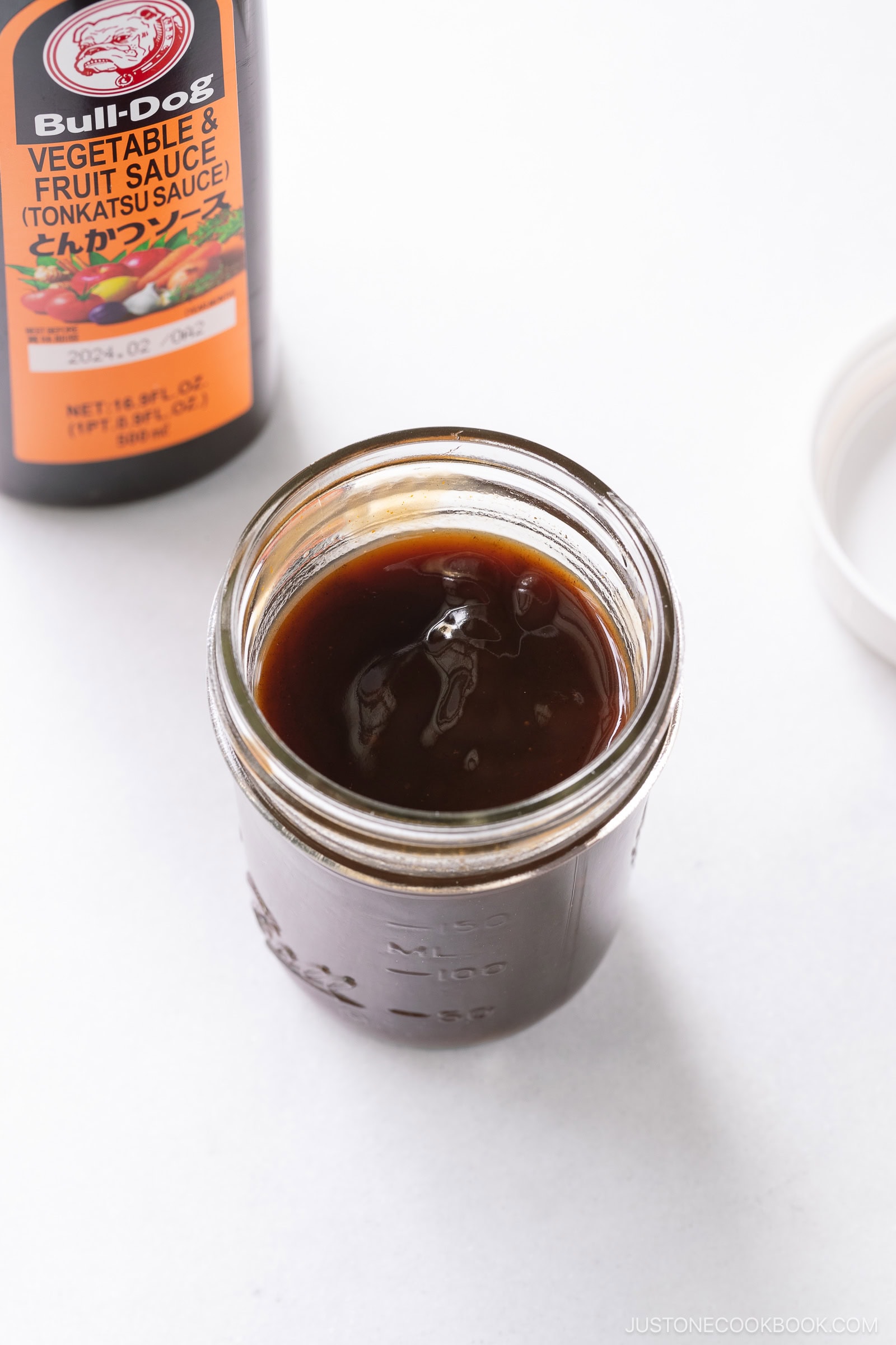 A bottle of Bulldog vegetable & fruit sauce (Tonkatsu sauce) and a mason glass jar of homemade tonkatsu sauce.