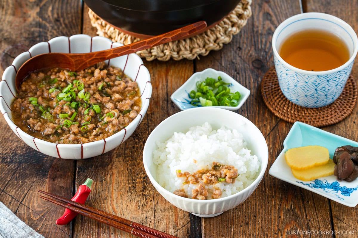 A round bowl containing Niku Miso, a savory Japanese ground pork dish seasoned with miso, mirin, and aromatics.
