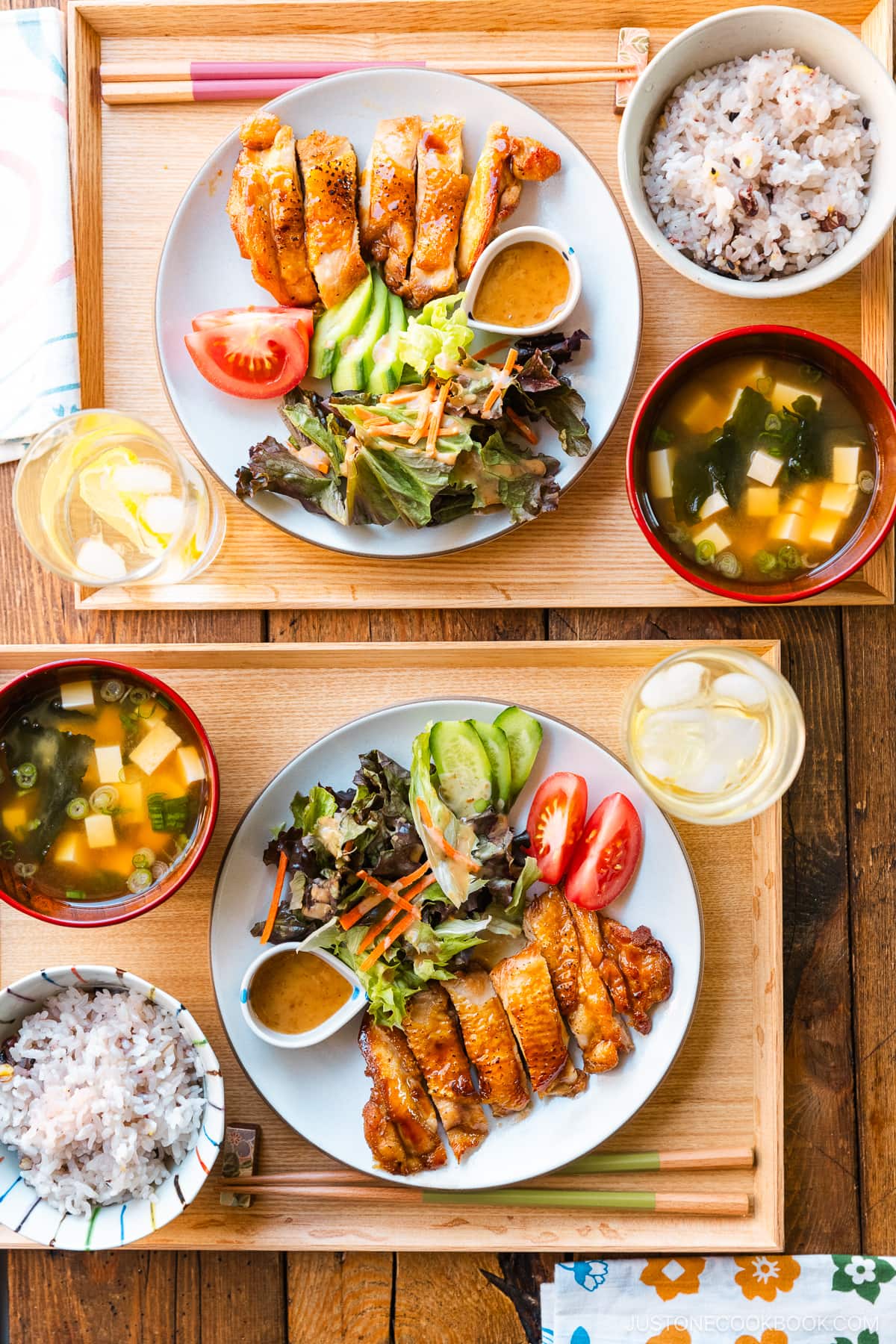 A round plate containing Chicken Teriyaki glazed with homemade teriyaki sauce.