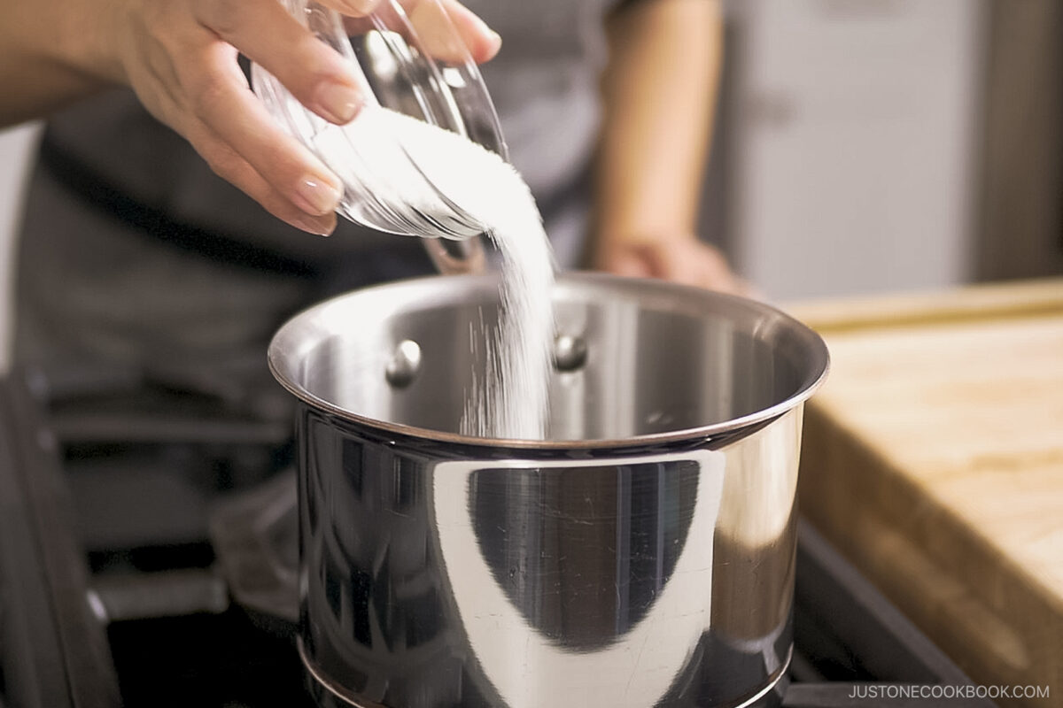 Add the sugar to the pot.