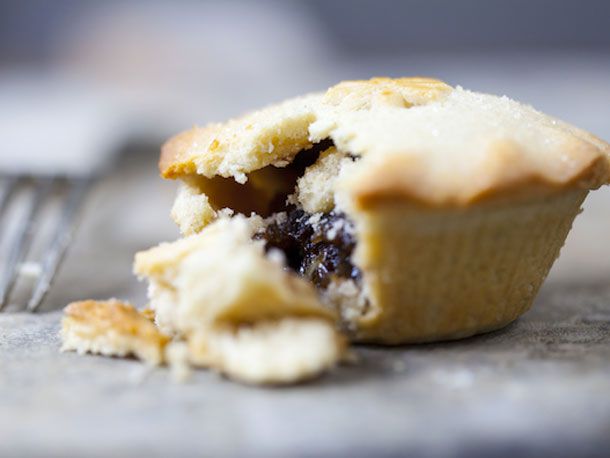 A small mincemeat pie broken open.