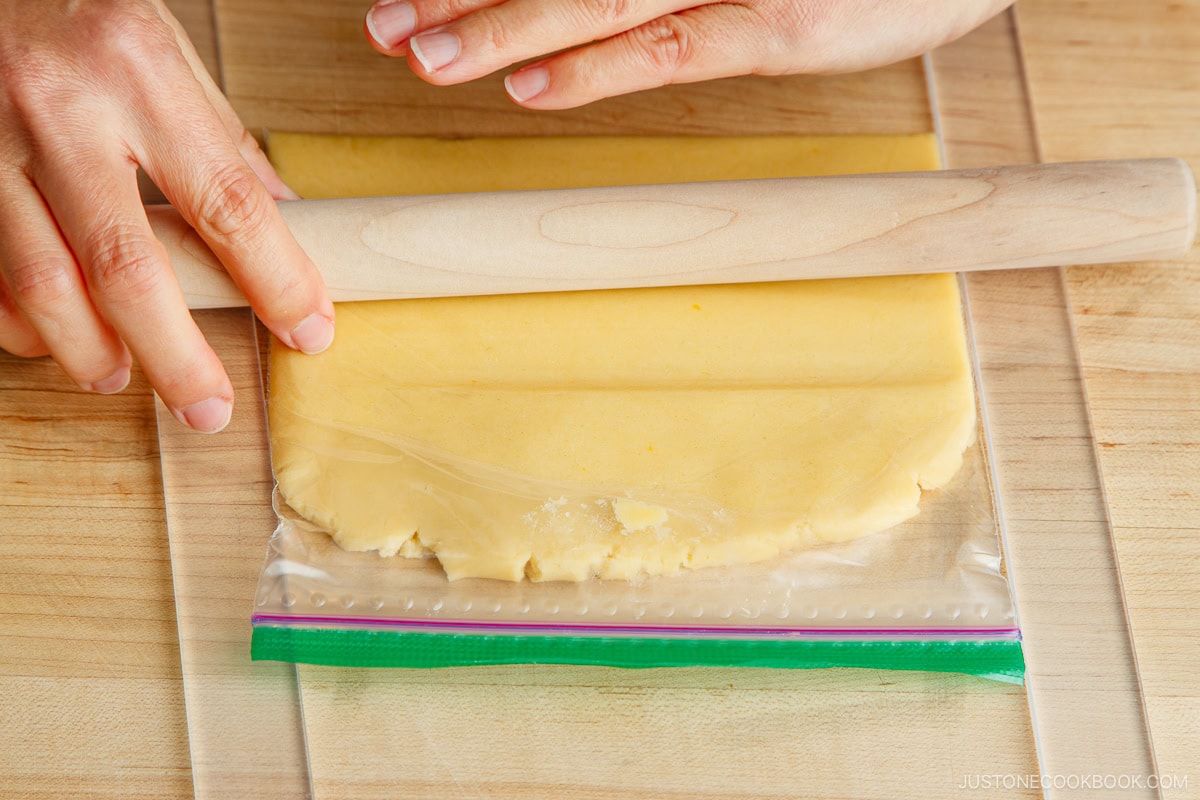 Rolling out the dough.