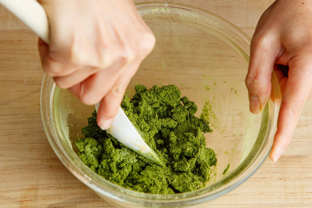 Adding matcha to the dough.