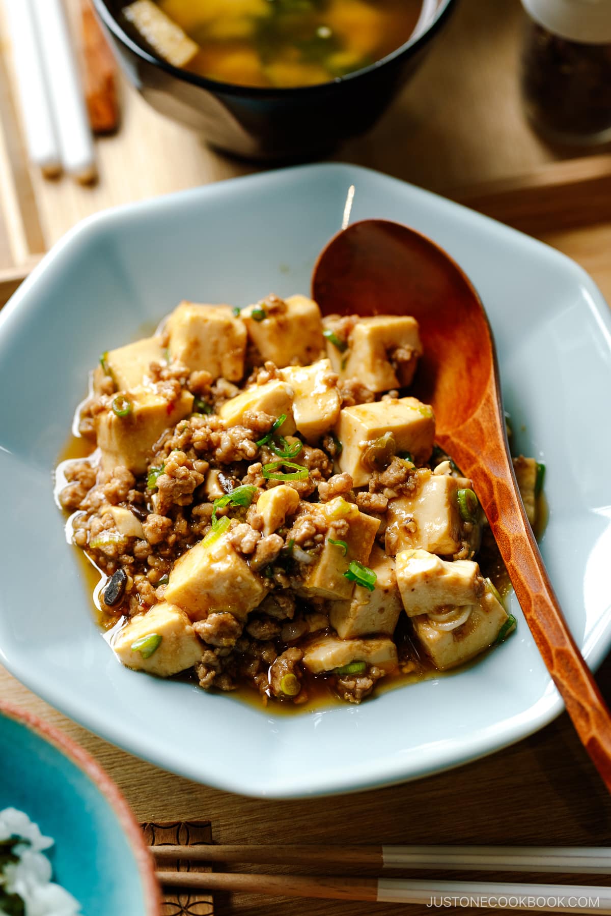 A ichiju sansai meal consists of steamed rice, miso soup, and mapo tofu.