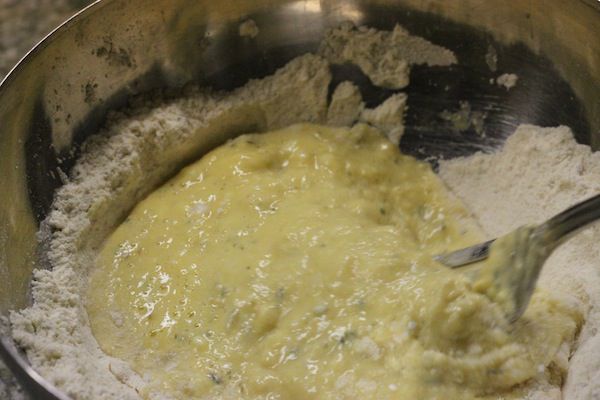 Beat the spatzle batter with a fork in a mixing bowl. 