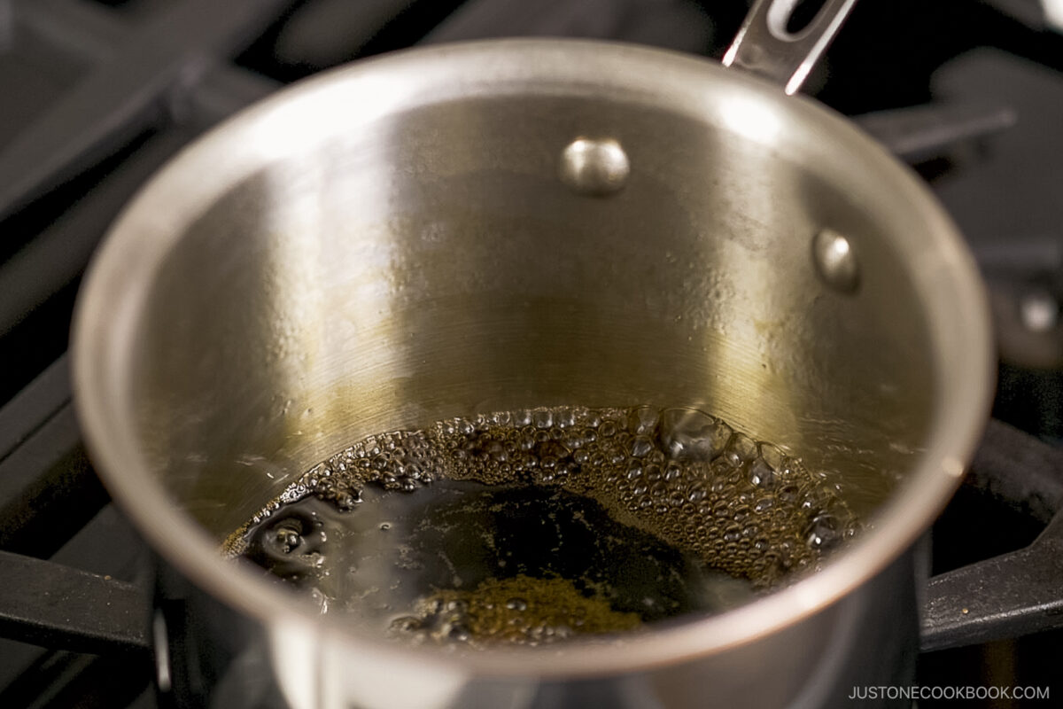 Cooking the teriyaki sauce in the pot.