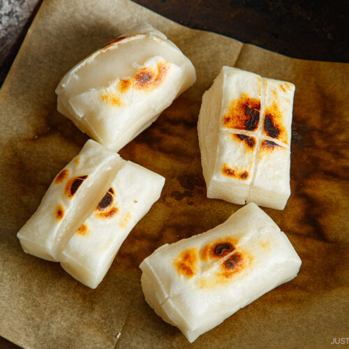 Toasting kiri mochi (Japanese rice cakes) in a frying pan.