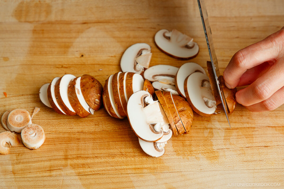 Slicing mushrooms.