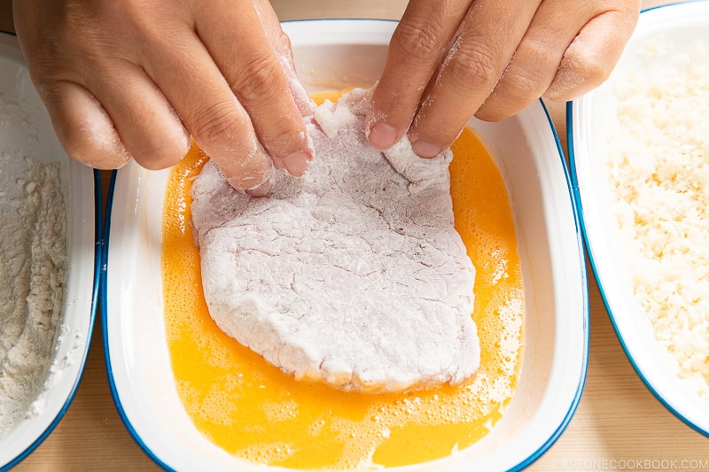 Dredge the cutlets in flour, then the egg mixture, then the panko mixture. 