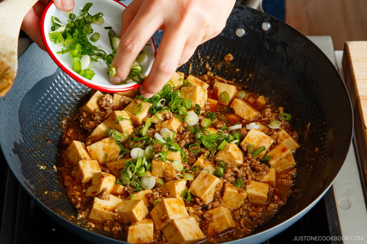 Add the tofu and green onions to the mapo tofu.