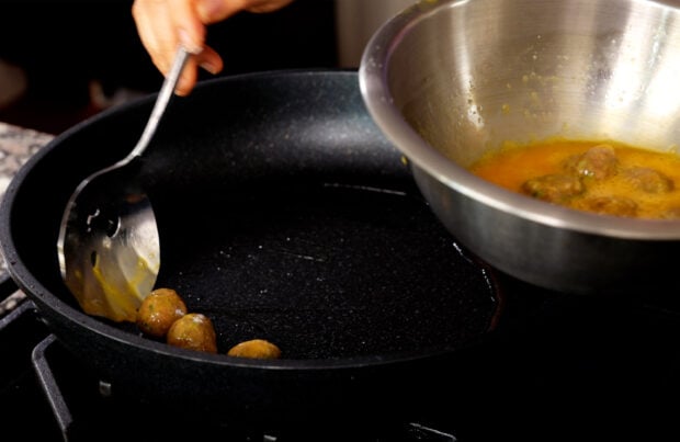 Cook wanja in a skillet