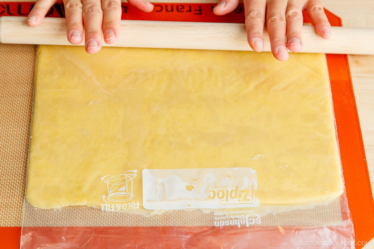 Rolling out the pastry dough.