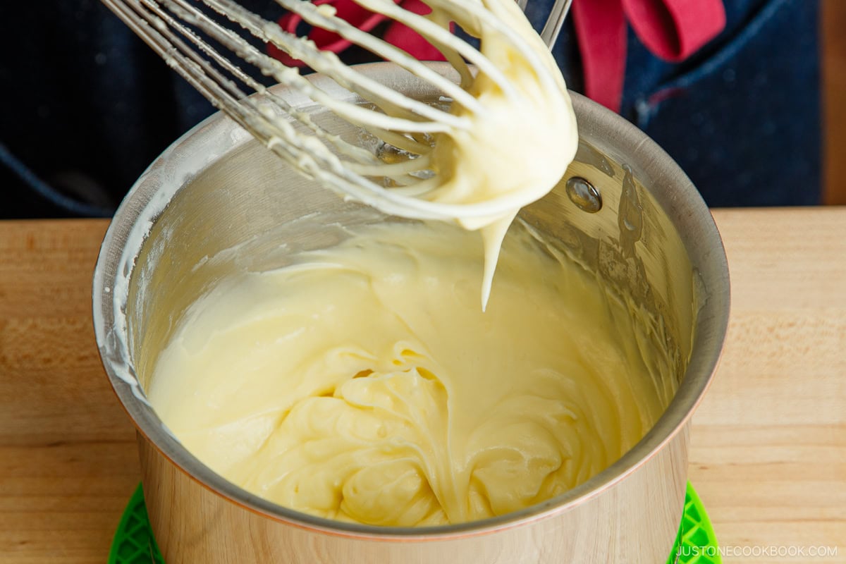 Whisk the cheese mixture until the right consistency.