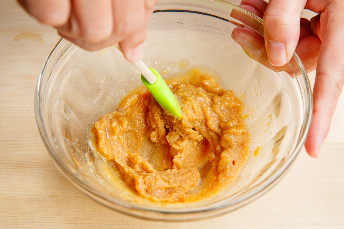 Add the sake and mirin to the sugar miso mixture.