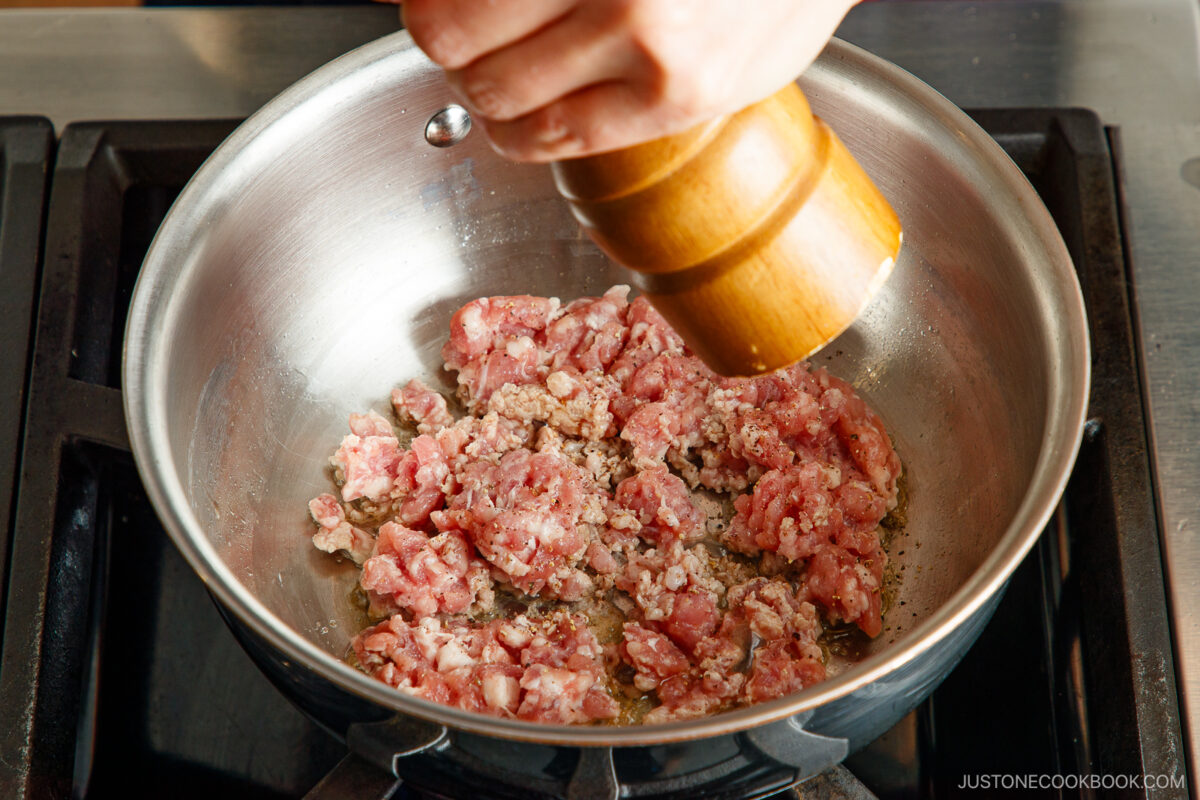 Cooking the ground pork in the pot.