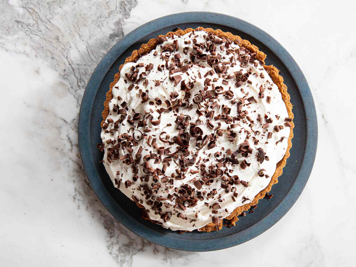 Banoffee pie on a blue plate.