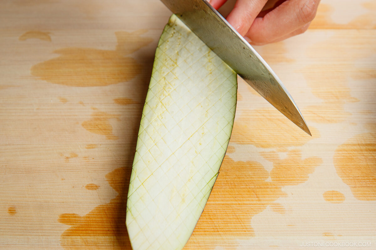 Scoring the eggplant.