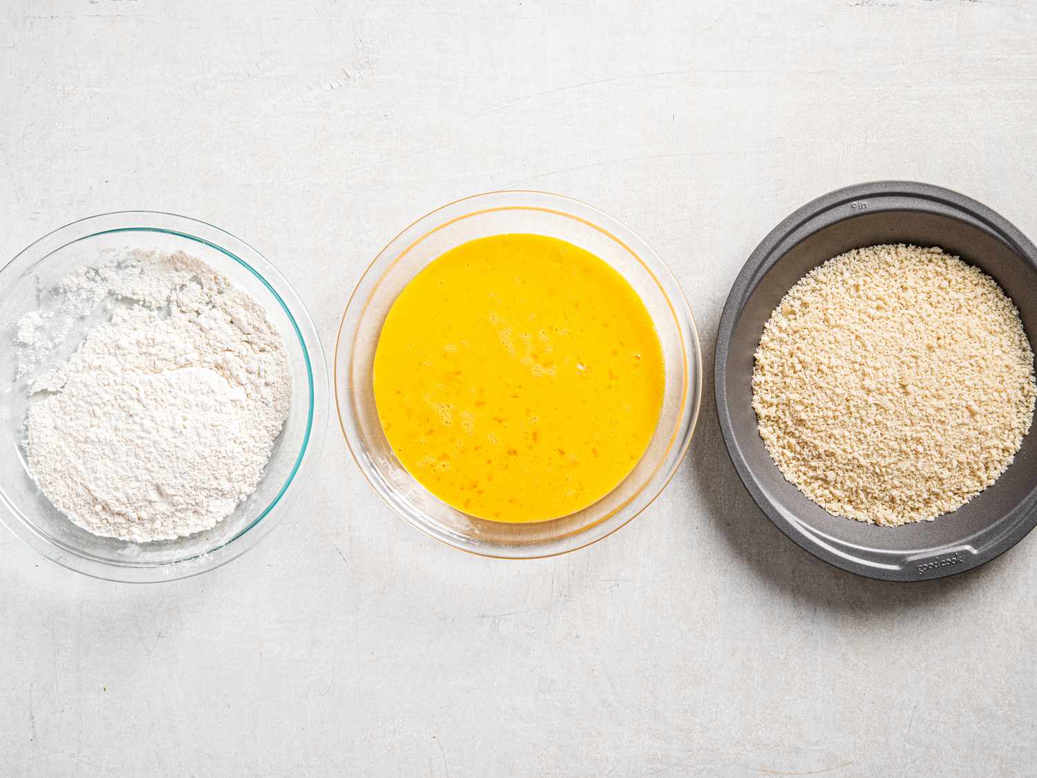 Bowls of flour, whisked eggs and panko 