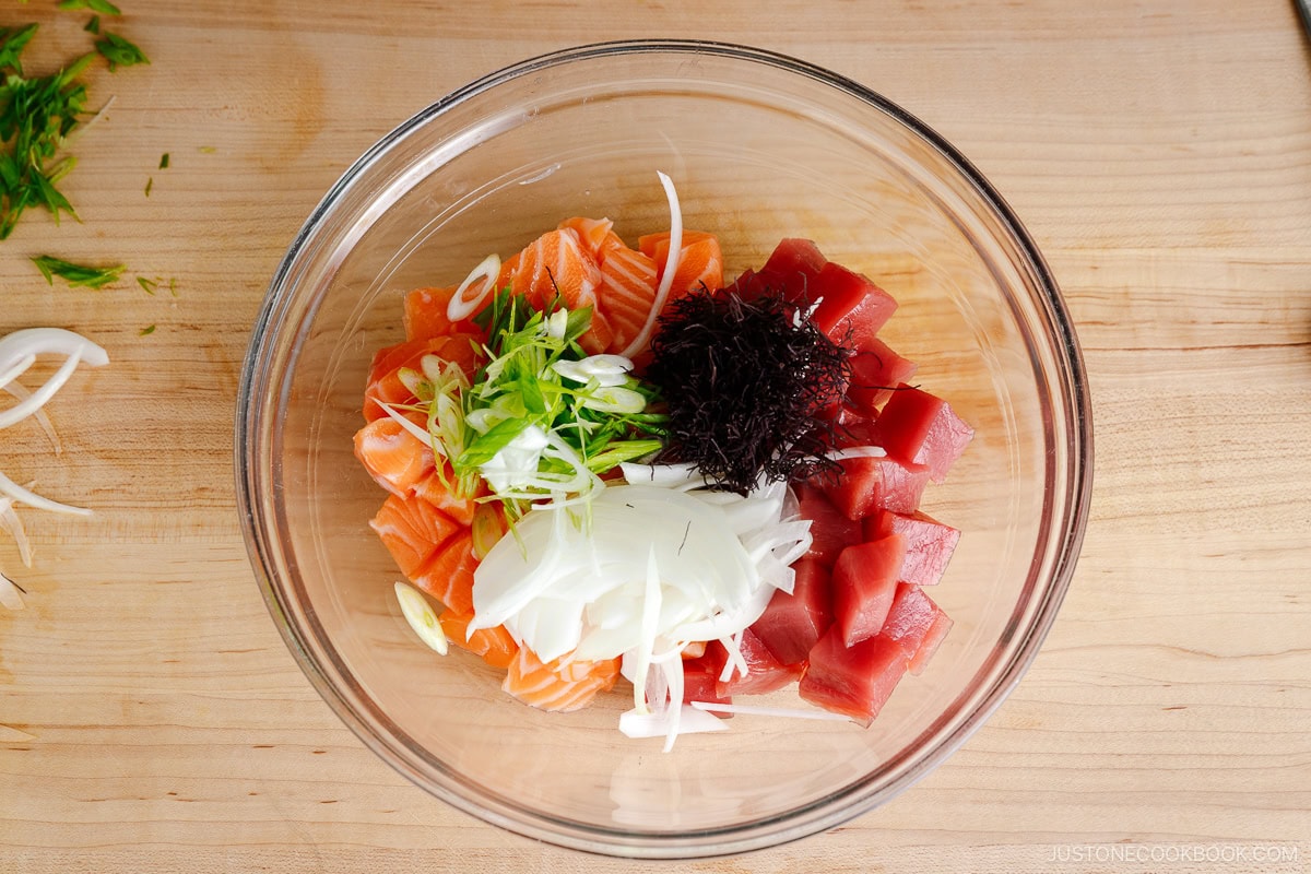 Put the poke ingredients in the bowl.