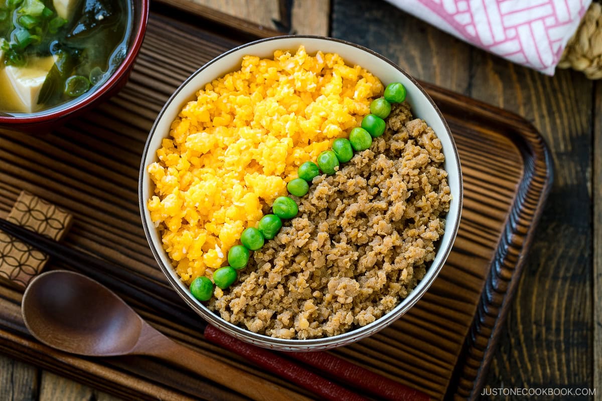 A bowl containing Soboro Don (seasoned ground chicken and scrambled egg over rice).