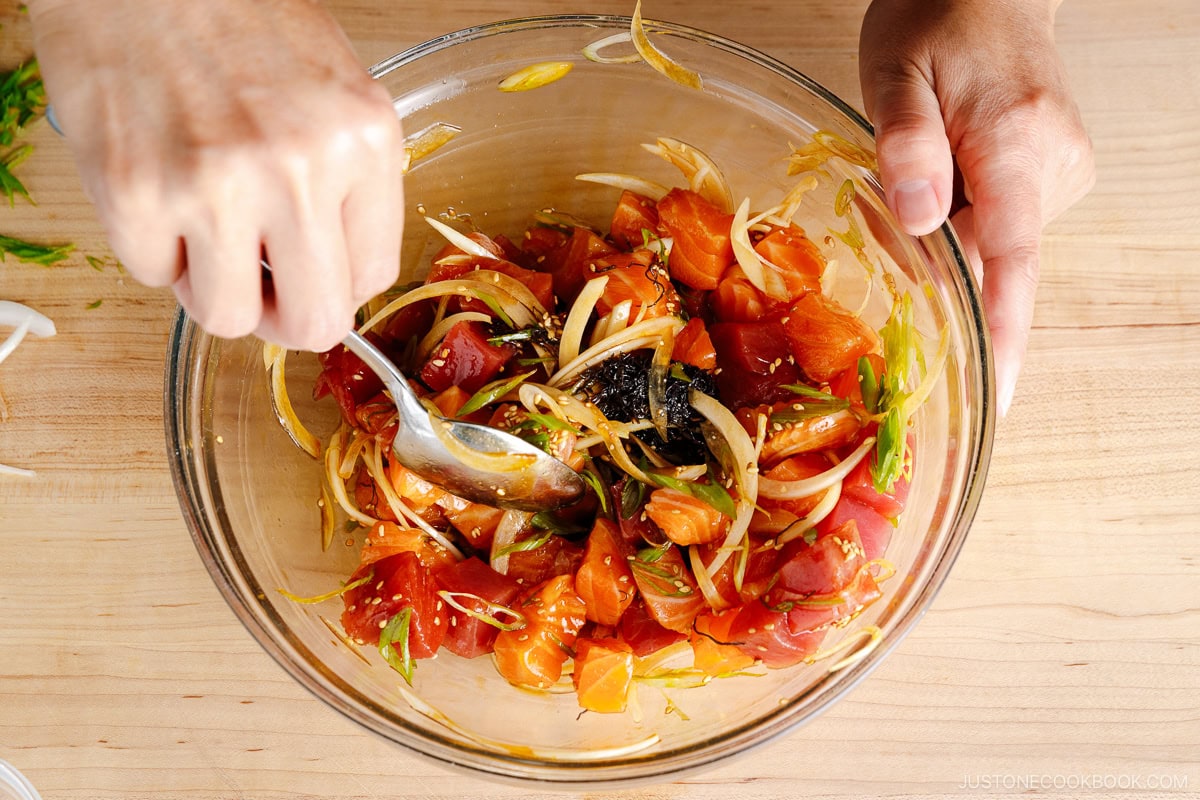 Mix the tuna and salmon poke ingredients with the seasonings.