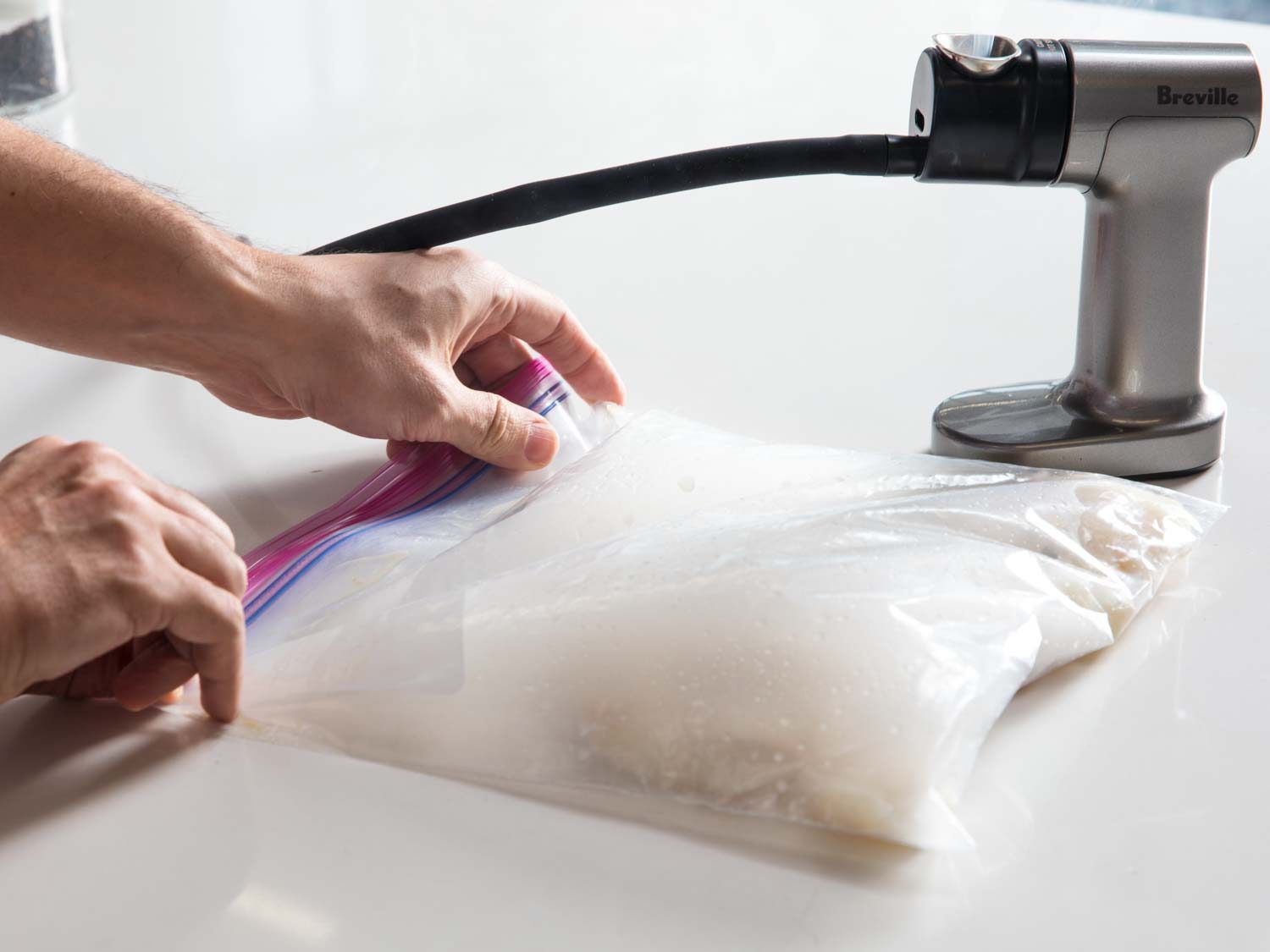 Using a smoking gun to smoke halibut in a zip-top bag.