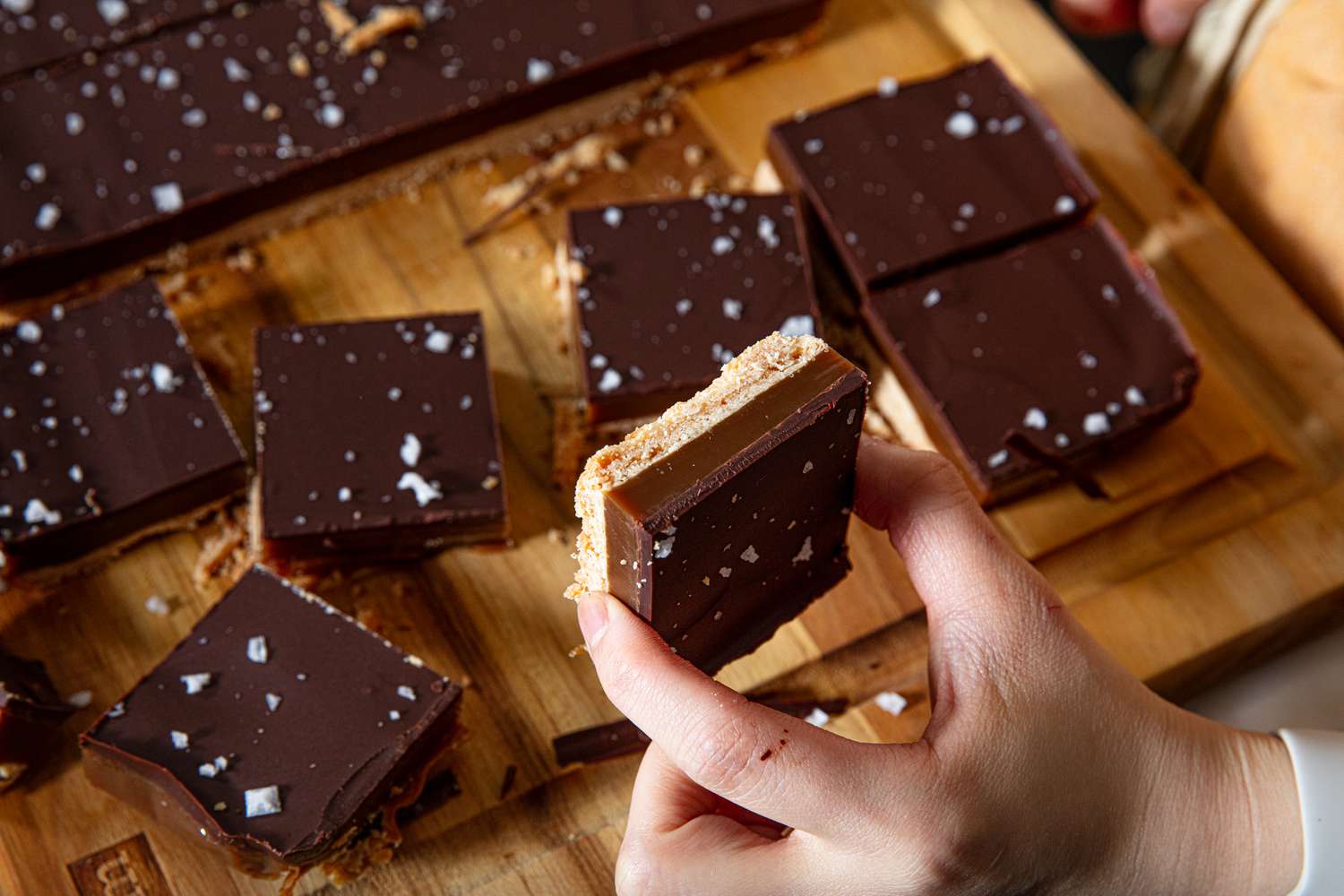 Side view of holding millionaires shortbread