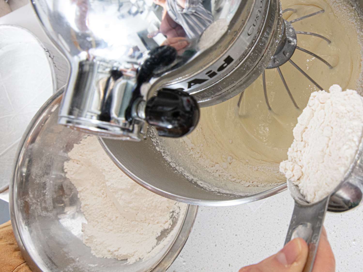 Adding flour to batter