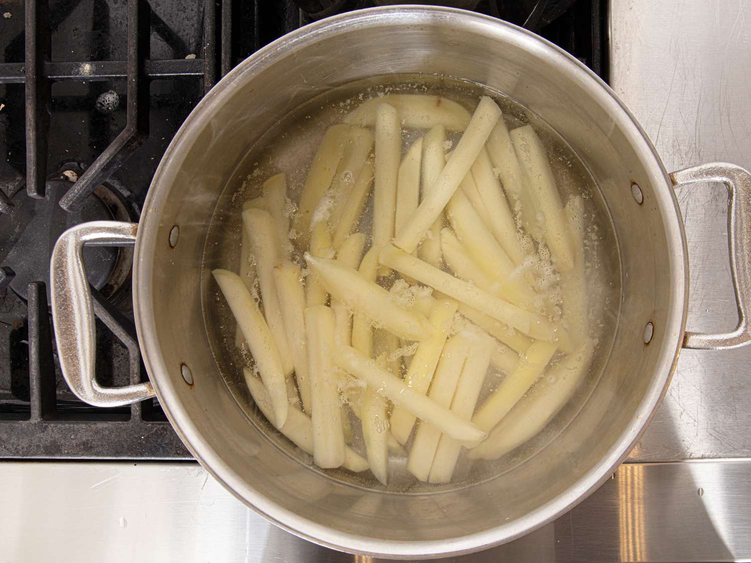 Overhead view of boiling potatoes