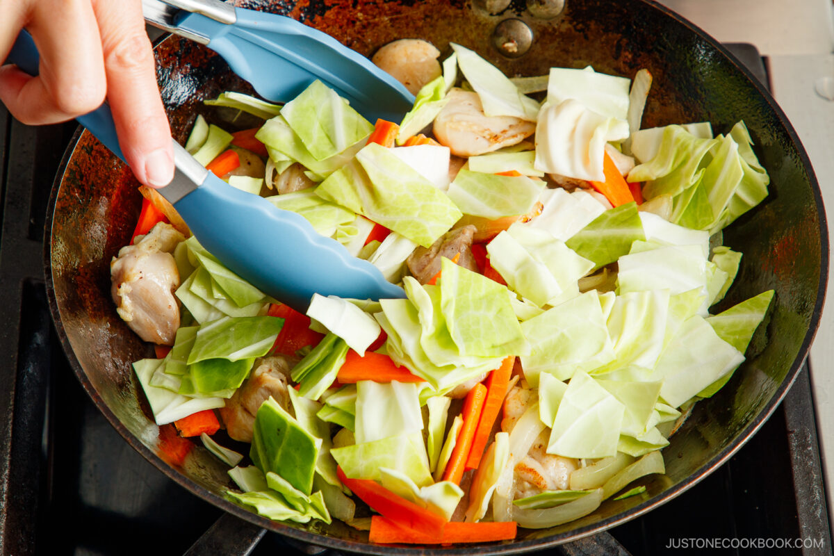Stir fry the vegetables.