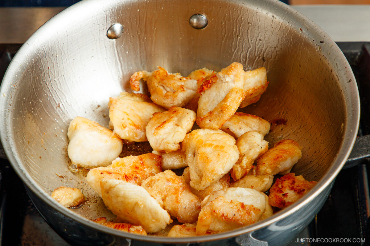 Add the chicken pieces back into the pot.