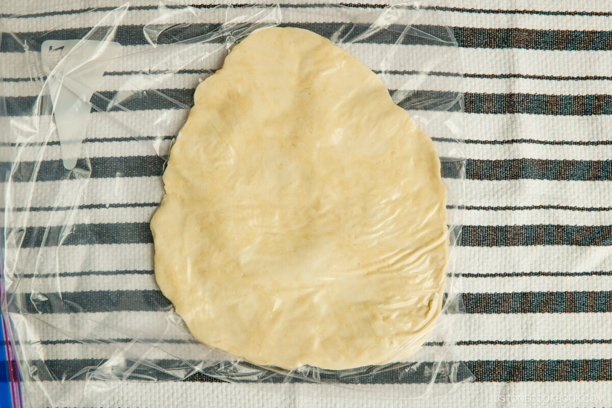 Steps until it's stretched and completely flat.