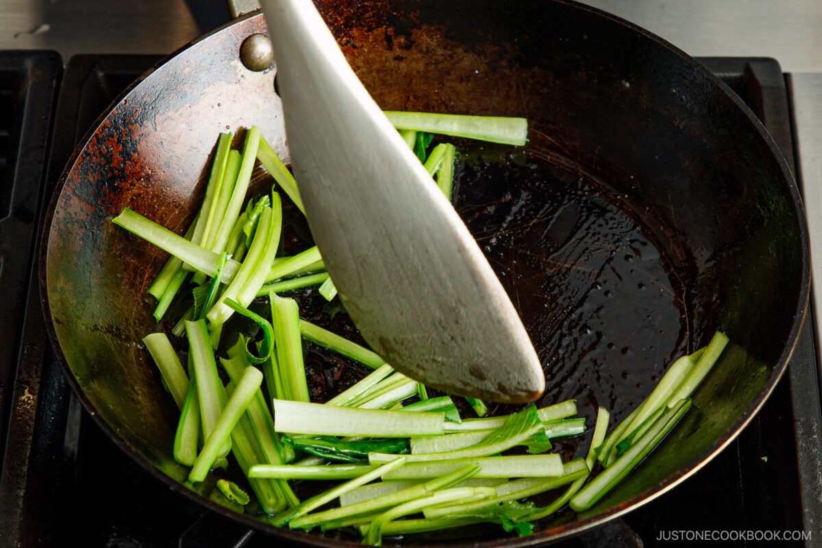 Stir fry the greens.