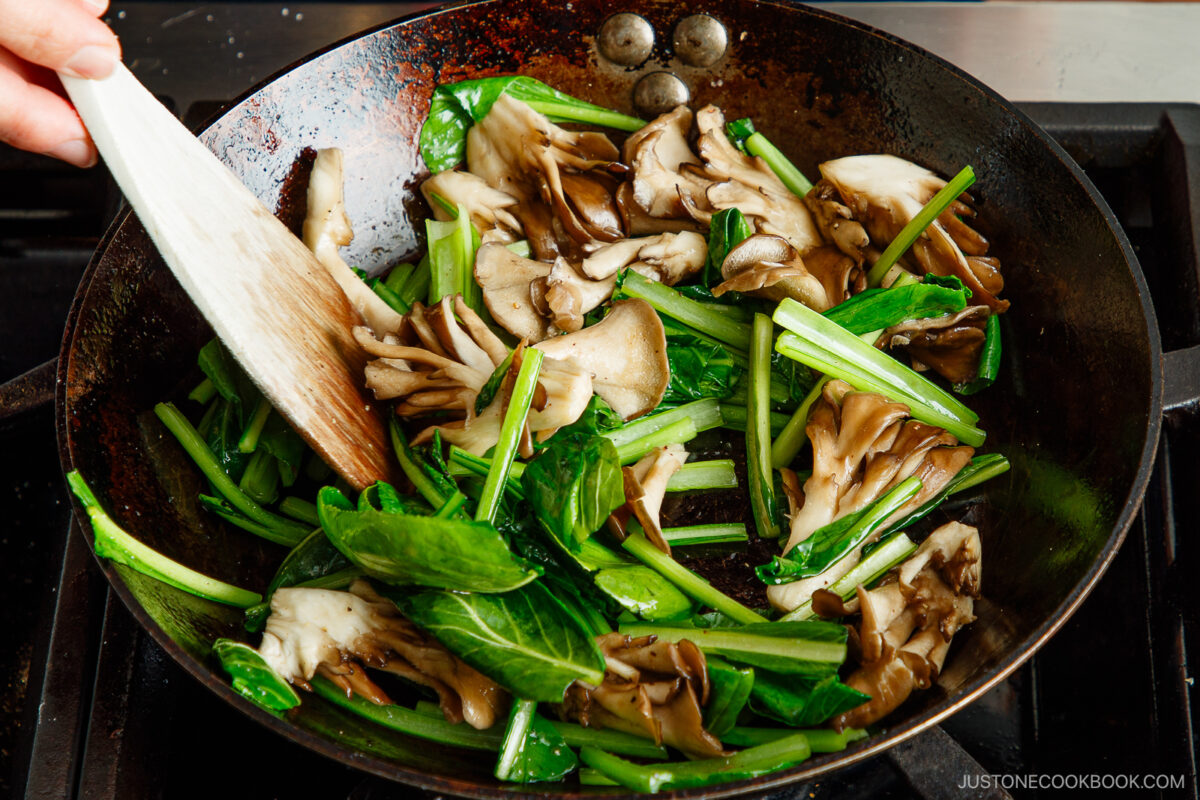 Stir fry the green and mushrooms.