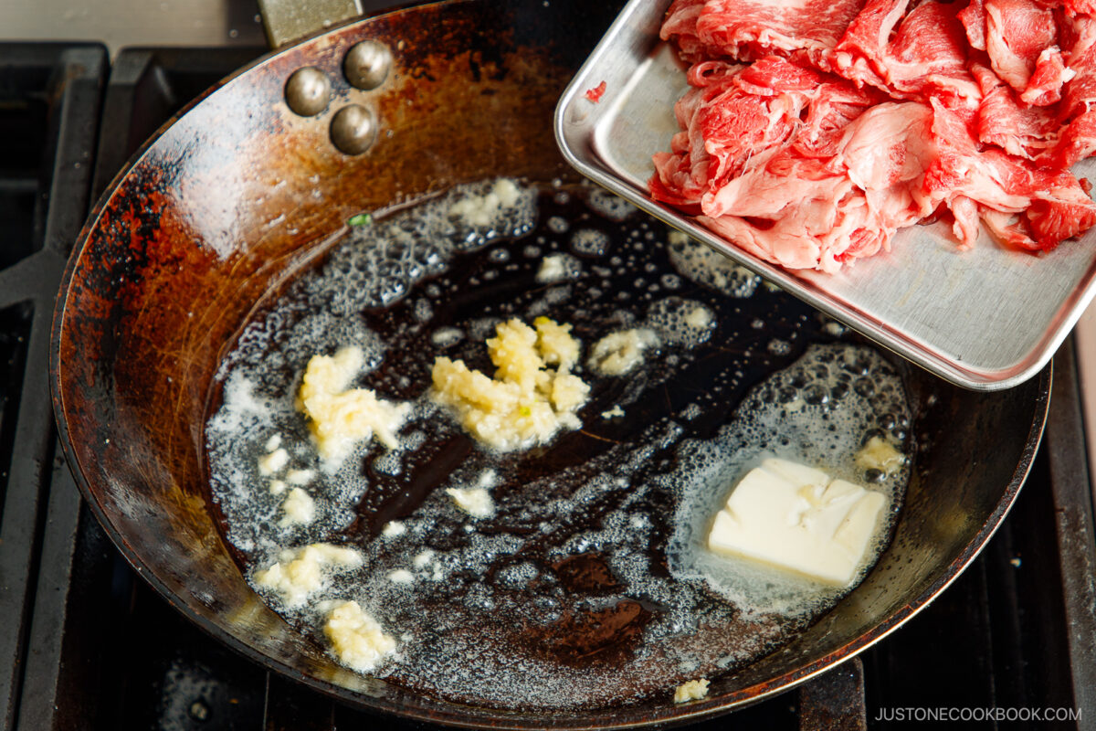 Add the beef to the garlic butter in the pan.