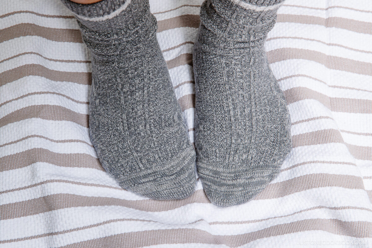 Step on the dough again. Repeat four more times or until it is soft like an earlobe.