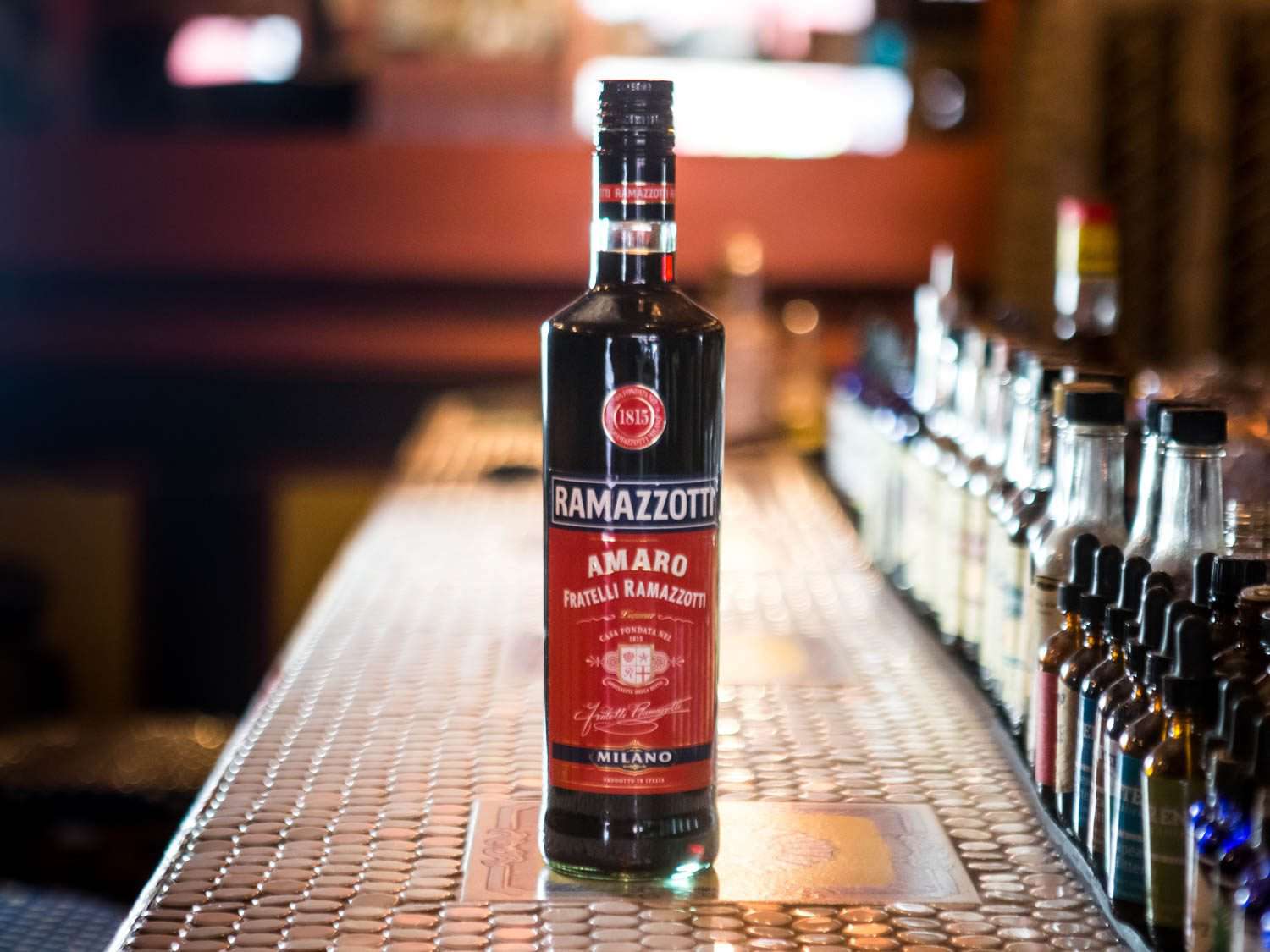A bottle of Ramazzotti on a bar counter. 