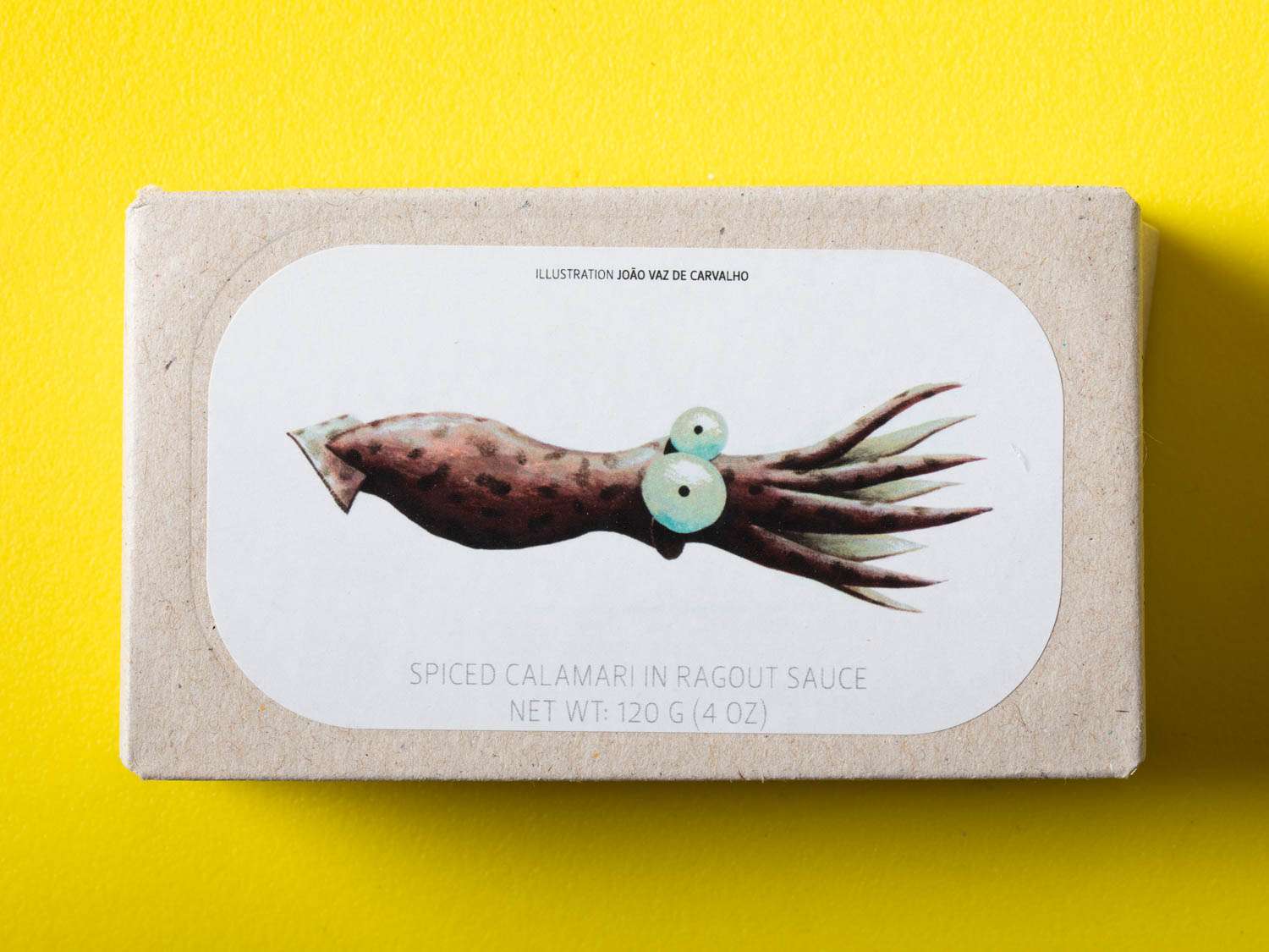 Packaging of Jose Gourmet spiced calamari in ragout on yellow background.