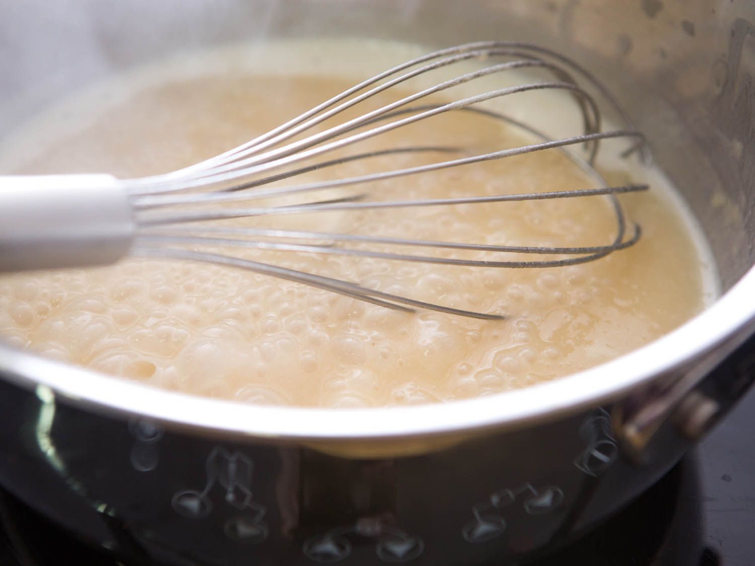 Whisking gravy for Swedish meatballs.