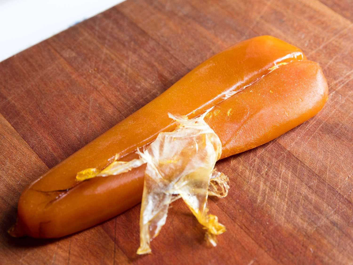 Mullet bottarga with pellicle partly removed.